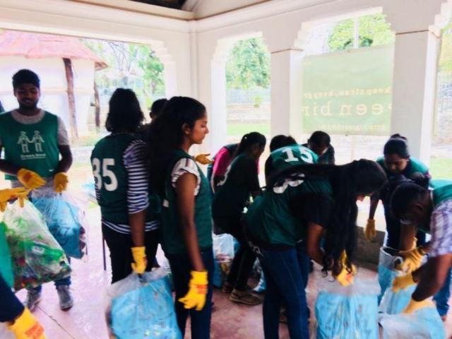 Green bird trash picking program